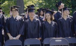 Row of students smile during Commencement