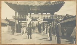 [Yongnam governor gate with Korean and American flags]
