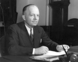 Harold Edward Stassen (1907-2001), at his desk, portrait photograph