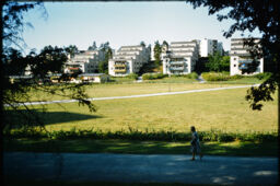 Open space and terraced housing in the distance (Vallingby, Stockholm, SE)