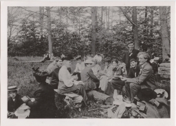 Liberty Hyde Bailey, dean of the New York State College of Agriculture, examines a sandwich at the first Tompkins County School Picnic, May 26, 1905 (with Anna Comstock)