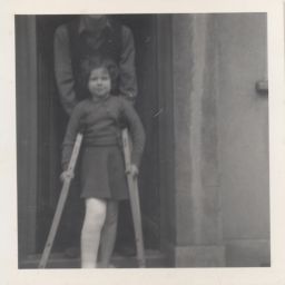 Photograph of Lindsay Cooper as a child with crutches