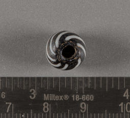 Black drawn glass bead with white stripes