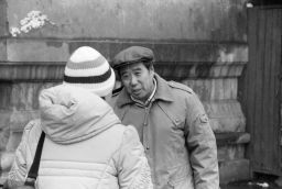 Man and woman talking in the Forbidden City.