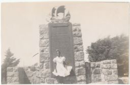 Young girl in front of monument