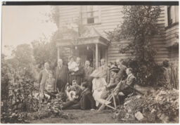 Group of people outside Mr. Thomas Adams' cottage, Beulah Hill