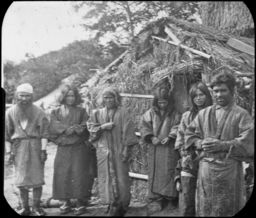 Ainu men and women outside chise