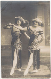 [Two female impersonators dancing]