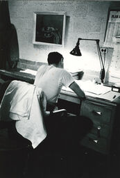 Mike Wallace – working under a lamp, in a white tee-shirt