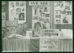 Two women at the National Gay Task Force booth