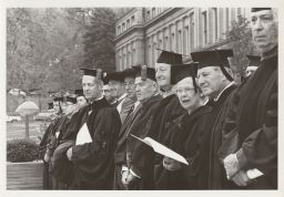 President Perkins, Adlai Stevenson, Board of Trustees Chairman Arthur H. Dean, and other dignitaries.