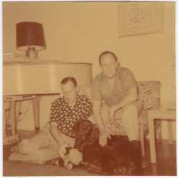 Photo of two men with dog