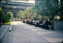 Park-goers seated in the shade of trees. (Mellon Square, Pittsburgh, Pennsylvania, USA)