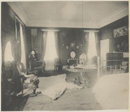Bedroom with bear skin rug in Horne residence