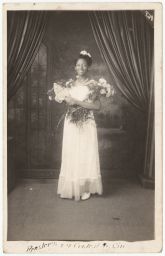 Woman in dress holding flowers