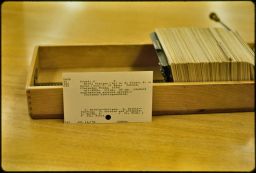 Book catalog card in front of catalog drawer