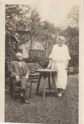 John Henry Comstock and Anna Botsford Comstock in front of their house.