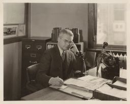 L.R. Simons in the Central Farm Bureau office.