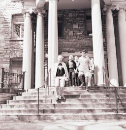 Students exiting the front entrance of Brokaw Hall