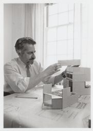 Joseph Carreiro constructing an architectural model.