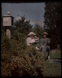 Anna Botsford Comstock and John Henry Comstock on a bench in their garden