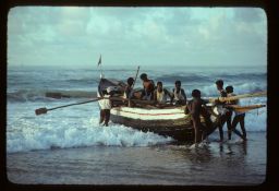 Fishermen boarding a boat at Puri Beach