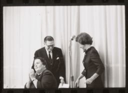 Dr. Moore and two unidentified women at microphone, Frame #4