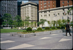 Paving and landscaping on top of the parking structure, with Pittsburgh buildings in the background (Mellon Square, Pittsburgh, Pennsylvania, USA)