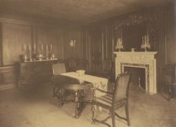 Interior: dining room, including table and fireplace