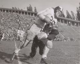 Football Player Being Tackled