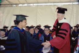 President Frank H. T. Rhodes shaking hands with graduate at Cornell Commencement
