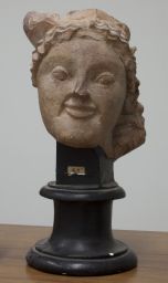 Head of terracotta maenad from Olympia