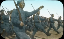 A close-up of the marching formation of uniformed Japanese troops