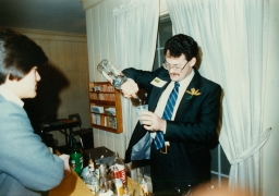 Man mixing drinks at event