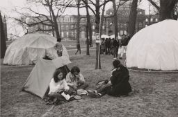Tent city on Arts Quad, people eating