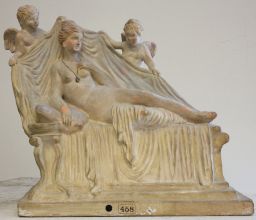 Terracotta figurine of nude Aphrodite reclining with two Erotes
