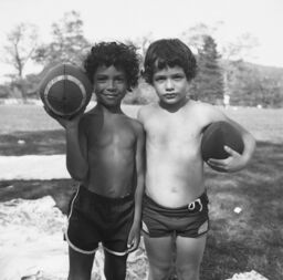Two boys with footballs
