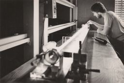 Clif Pollack's lab: Larry Stratten with HeNe (helium-neon) laser, 1983