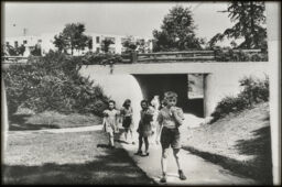 Children running along a pedestrian path, including an underpass (Greenbelt, Maryland, USA)