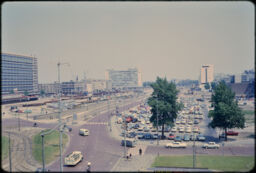 Alarge parking area, wide streets, and several buildings in downtown Rotterdam (Rotterdam, NL)