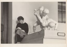 Female student studying in cast gallery.