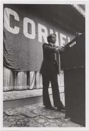 Theodore Lowi standing at a podium during the New York Convocation