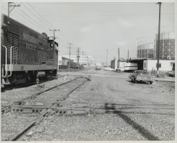 Locomotive About to Cross Western Pacific Track in Foreground
