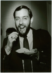 Portrait of a man eating hors d'oeuvres