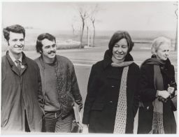 Elizabeth Berrigan McAlister smiling with others in a candid photo