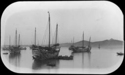 Three large ships and other boats in the harbor of Chefoo (Yantai)