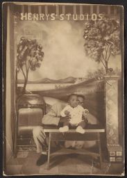 Man sitting with baby on a bench