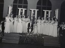People wearing evening wear on stage