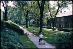 Children playing along an interior pathway through a neighborhood greenway (Chatham Village, Pittsburgh, Pennsylvania, USA)