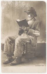Man reading in rocking chair